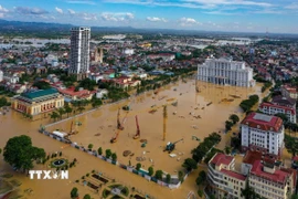 Khu vực trung tâm của tỉnh Thái Nguyên ngập sâu trong nước lũ. (Ảnh: Phạm Tuấn Anh/TTXVN)