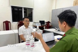 Ông Phạm Đình Tuấn tại cơ quan điều tra. (Ảnh: TTXVN phát)