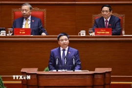 Đồng chí Nguyễn Văn Thắng, Ủy viên Trung ương Đảng, Bí thư Đảng ủy, Bộ trưởng Bộ Tài chính, trình bày tham luận “Hoàn thiện thể chế, pháp luật về huy động, sử dụng nguồn lực tài chính đáp ứng yêu cầu phát triển đất nước nhanh và bền vững”. (Ảnh: TTXVN)