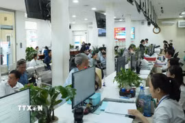 Chính quyền hai cấp đòi hỏi cán bộ phải thay đổi phương pháp làm việc, từ chờ chỉ đạo sang chủ động giải quyết công việc. (Ảnh: Hữu Duyên/TTXVN)