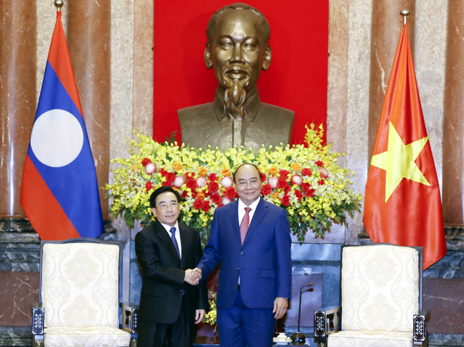 [Photo] Chủ tịch nước Nguyễn Xuân Phúc tiếp Thủ tướng Lào ảnh 1