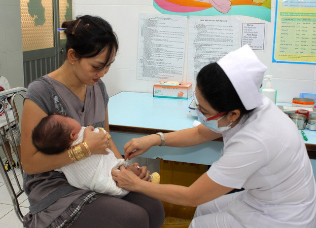 Không có cảnh chen lấn đi tiêm vắcxin 5 trong 1 tại TP.HCM ảnh 1