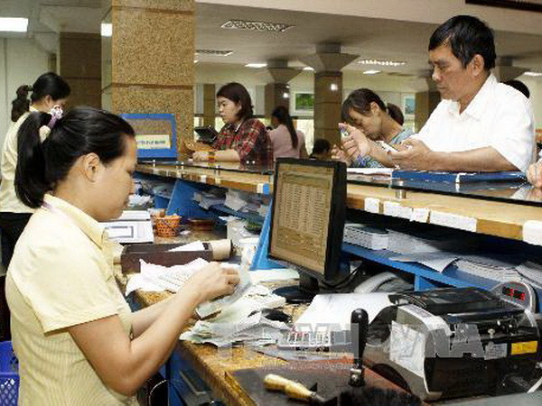 Hà Nội thí điểm thành công chi trả lương qua bưu điện ảnh 1