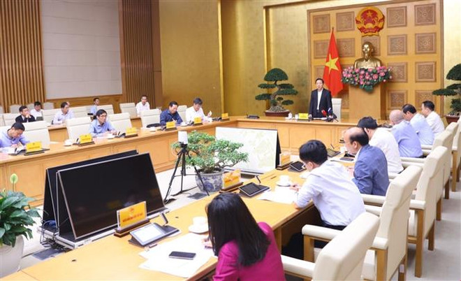 Quang cảnh cuộc họp. (Ảnh: Văn Điệp/TTXVN) Tháo gỡ khó khăn từng dự án để thúc đẩy giải ngân vốn đầu tư công ảnh 2