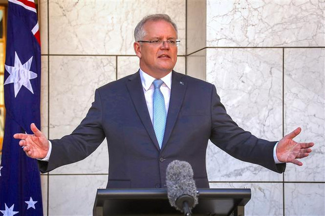 Thủ tướng Australia Scott Morrison phát biểu tại Canberra. (Nguồn: AFP/TTXVN) Chính phủ Australia thông qua chính sách tiêm chủng quốc gia mới ảnh 1