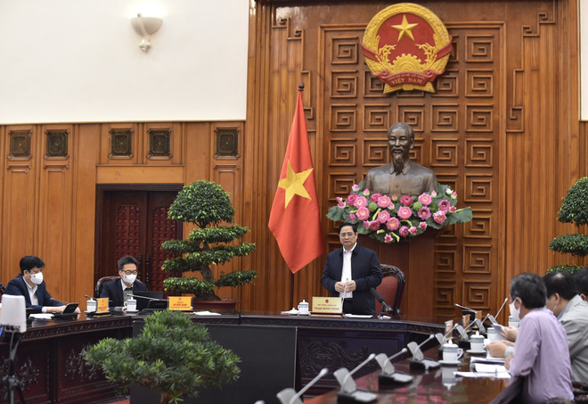 [Photo] Thủ tướng Phạm Minh Chính chủ trì cuộc họp về vaccine COVID-19 ảnh 3