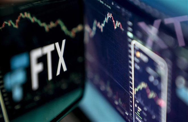 Biểu tượng của sàn giao dịch tiền kỹ thuật số FTX trên màn hình máy tính. (Ảnh: AFP/TTXVN) Năm 2022 - năm 'thảm họa' của thị trường tiền số toàn cầu ảnh 1