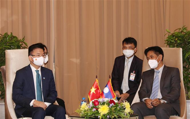 Bộ trưởng Bộ Tư pháp Lê Thành Long gặp Bộ trưởng Bộ Tư pháp Lào ảnh 1