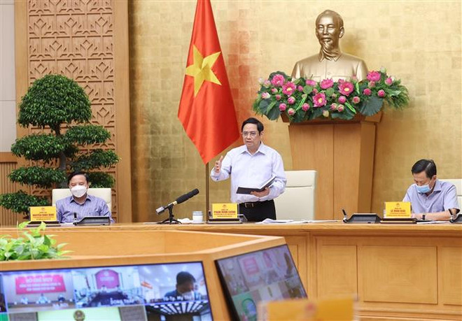 Sáng 29/8, tại tại Trụ sở Chính phủ, Thủ tướng Phạm Minh Chính, Trưởng Ban Chỉ đạo chủ trì họp trực tuyến Ban Chỉ đạo Quốc gia phòng, chống dịch COVID-19 với các xã, phường, thị trấn tại 20 tỉnh, thành phố đang thực hiện giãn cách xã hội về phòng, chống dịch COVID-19. (Ảnh: Dương Giang/TTXVN) Nhiệm vụ thành viên Ban Chỉ đạo Quốc gia phòng, chống dịch COVID-19 ảnh 1