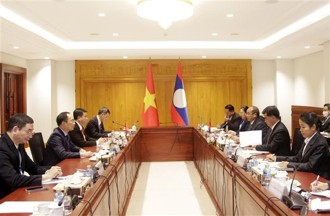 Việt Nam và Lào chia sẻ kinh nghiệm các vấn đề về dân tộc ảnh 1