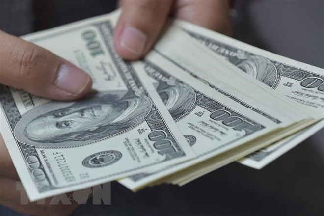 Tỷ lệ nợ/tổng sản phẩm quốc nội (GDP) của các thị trường mới nổi lại tăng lên mức cao kỷ lục. (Ảnh: AFP/TTXVN) Tỷ lệ nợ của các thị trường mới nổi tăng lên mức kỷ lục ảnh 1