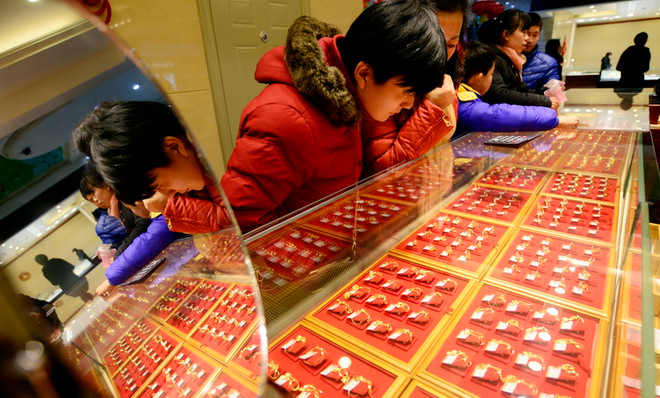 Giá vàng châu Á giảm khi nhu cầu đối với tài sản rủi ro tăng ảnh 1