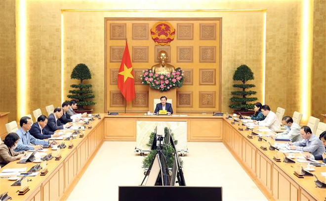 Quang cảnh cuộc họp. (Ảnh: Phạm Kiên/TTXVN) Phó Thủ tướng: Điều hành linh hoạt, hiệu quả giá mặt hàng thiết yếu ảnh 1