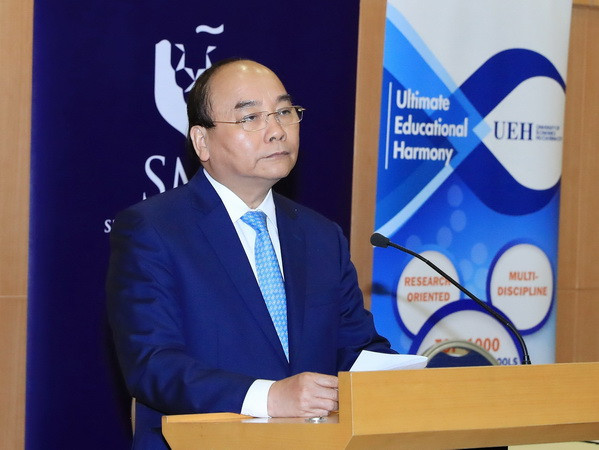 Thủ tướng Nguyễn Xuân Phúc. (Ảnh: Thống Nhất/TTXVN) Thủ tướng dự tọa đàm bàn tròn với các công ty đa quốc gia ảnh 1