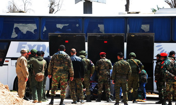 Syria: Các tay súng nổi dậy rời khỏi thành trì cuối cùng ở Đông Ghouta ảnh 1