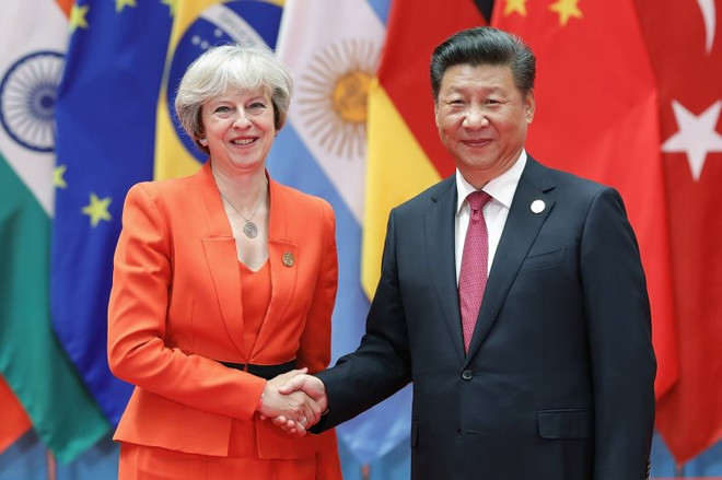 Chủ tịch Trung Quốc Tập Cận Bình và Thủ tướng Anh Theresa May. (Nguồn: Getty Images) Chủ tịch Trung Quốc Tập Cận Bình điện đàm với Thủ tướng Anh ảnh 1