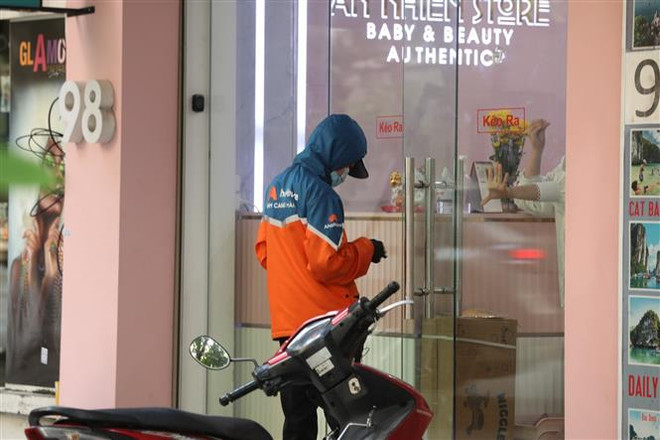 VECOM kiến nghị tạo thuận lợi cho shipper hoạt động tại Hà Nội, TP.HCM ảnh 1