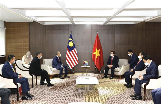 Thủ tướng Phạm Minh Chính hội kiến Thủ tướng Malaysia Muhyiddin Yassin. (Ảnh: Dương Giang/TTXVN) Thủ tướng Phạm Minh Chính gặp lãnh đạo Campuchia, Singapore, Malaysia ảnh 3