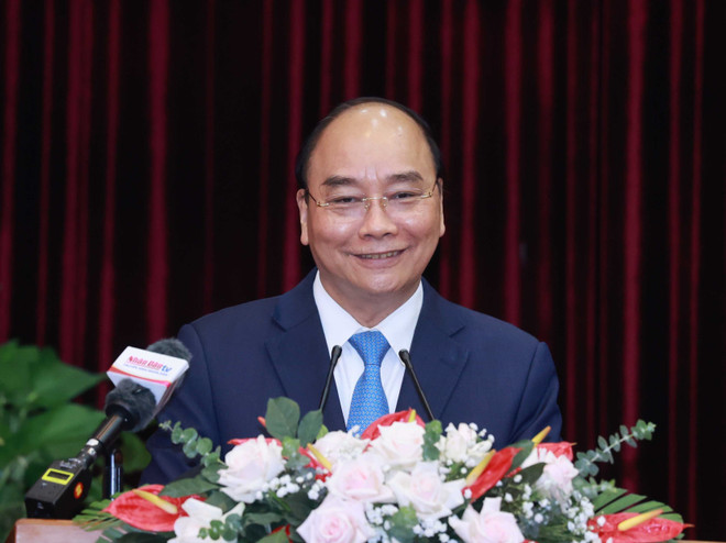 Chủ tịch nước Nguyễn Xuân Phúc phát biểu tại buổi làm việc. (Ảnh: Thống Nhất/TTXVN) Chủ tịch nước: Đà Nẵng, Quảng Nam cần tìm ra lĩnh vực mũi nhọn ảnh 1