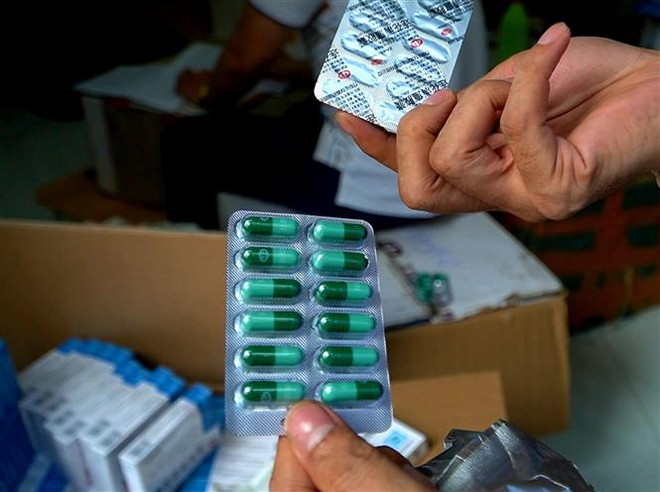 Bộ Công an thu giữ gần 10.000 hộp thuốc 'Liên Hoa Thanh Ôn' ảnh 1