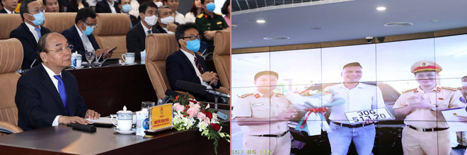 Thủ tướng Nguyễn Xuân Phúc, Chủ tịch Ủy ban Chính phủ điện tử quốc gia và các đại biểu trải nghiệm dịch vụ công quốc gia qua việc bấm biển số tại Phòng Cảnh sát giao thông Hà Nội. (Ảnh: Thống Nhất/TTXVN) Dịch vụ công thứ 1.000 và dấu mốc mới cho một Chính phủ hiện đại ảnh 2