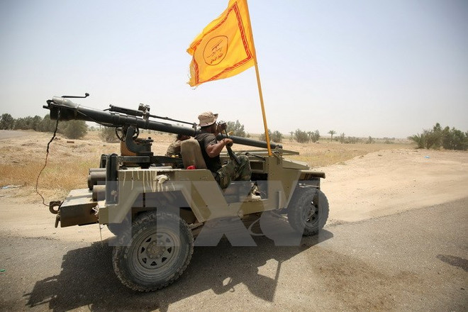 Gần 10 vạn thường dân mắc kẹt trong thành trì của IS tại Iraq ảnh 1