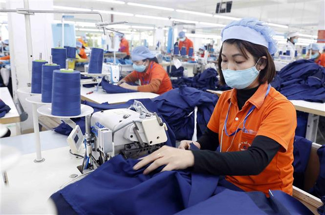 (Ảnh minh họa: Trần Việt/TTXVN) Doanh nghiệp các khu công nghiệp vượt khó để đẩy mạnh sản xuất ảnh 1