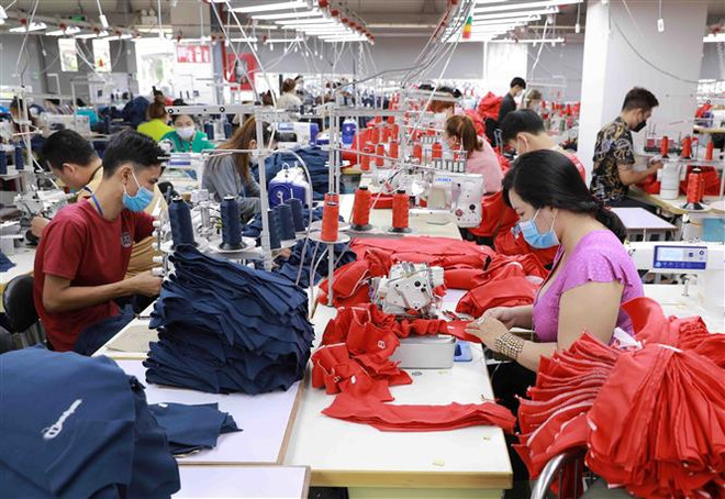 May hàng xuất khẩu ở tỉnh An Giang, Việt Nam. (Ảnh: Vũ Sinh/TTXVN) IMF: Châu Á có thể là điểm sáng trong bối cảnh kinh tế toàn cầu u ám ảnh 1