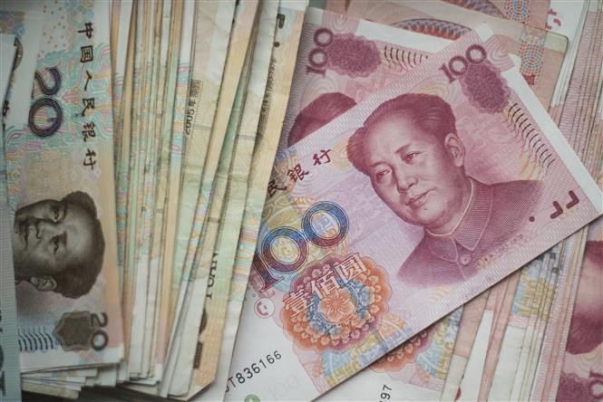 Đồng nhân dân tệ tại một ngân hàng ở Bắc Kinh, Trung Quốc. (Ảnh: AFP/TTXVN)