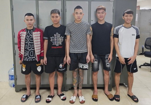 Các đối tượng tại cơ quan Công an. (Ảnh: TTXVN phát)