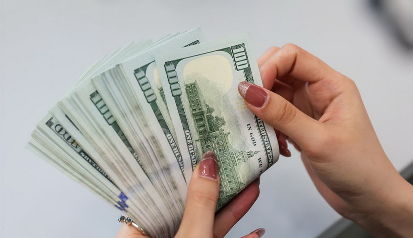 Tỷ giá giữa đồng VND và đồng USD giảm. (Ảnh: Vietnam+)