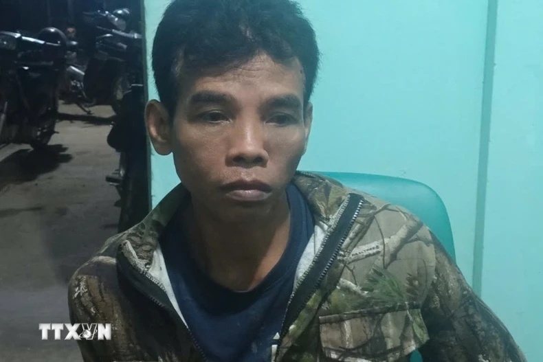 Đối tượng Điểu Trung bị bắt. (Ảnh: TTXVN phát)