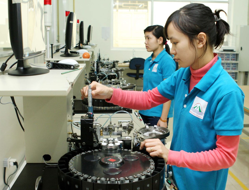 Sản xuất nhân chíp. (Ảnh: Trần Việt/TTXVN)