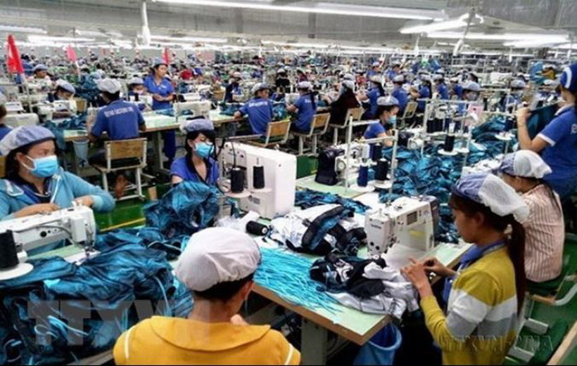 Sản xuất hàng may mặc xuất khẩu tại Công ty may mặc New Apparel, Khu công nghiệp Bắc Đồng Phú, tỉnh Bình Phước. (Ảnh: Dương Chí Tưởng/TTXVN)