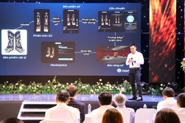 Các chuyên gia chia sẻ những công nghệ mới để số hóa di sản Huế nhằm tạo kho dữ liệu số, cách thức quảng bá, giới thiệu sản phẩm văn hoá đến người dùng trên không gian số. (Ảnh: Đỗ Trưởng/TTXVN)