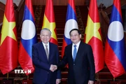 Tổng Bí thư Tô Lâm hội kiến Thủ tướng Chính phủ Lào Sonexay Siphandone. (Ảnh: Thống Nhất/TTXVN)