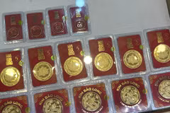Giá vàng trong nước tăng giảm trái chiều nhau, tỷ giá trung tâm tăng nhẹ. (Ảnh: Vietnam+)