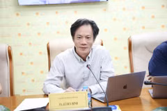 Tiến sĩ Lê Duy Bình - Giám đốc Economica Việt Nam phát biểu tại tọa đàm "Tạo lập khuôn khổ pháp lý đồng bộ về xử lý nợ xấu". (Ảnh: Vietnam+)
