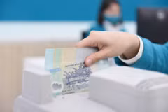 Luật Các tổ chức tín dụng 2024 và những bất cập trong xử lý nợ xấu hiện nay. (Ảnh: Vietnam+)