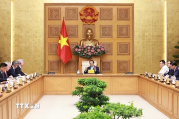 Thủ tướng Phạm Minh Chính làm việc với Đoàn Hội đồng kinh doanh Hoa Kỳ-ASEAN. (Ảnh: Dương Giang/TTXVN)