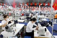 Không khí sản xuất ngày đầu năm tại Xí nghiệp Veston Hưng Hà thuộc Tổng Công ty May 10 (xã Hưng Hà, tỉnh Hưng Yên). (Ảnh: Thế Duyệt/TTXVN)