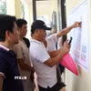 Người dân bốc thăm đất tái định cư phục vụ Dự án Cảng hàng không quốc tế Gia Bình. (Ảnh: Thanh Thương/TTXVN)
