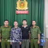 Đối tượng Hoàng Ngọc Sơn và Cao Thanh Lập tại cơ quan điều tra. (Ảnh: TTXVN phát)
