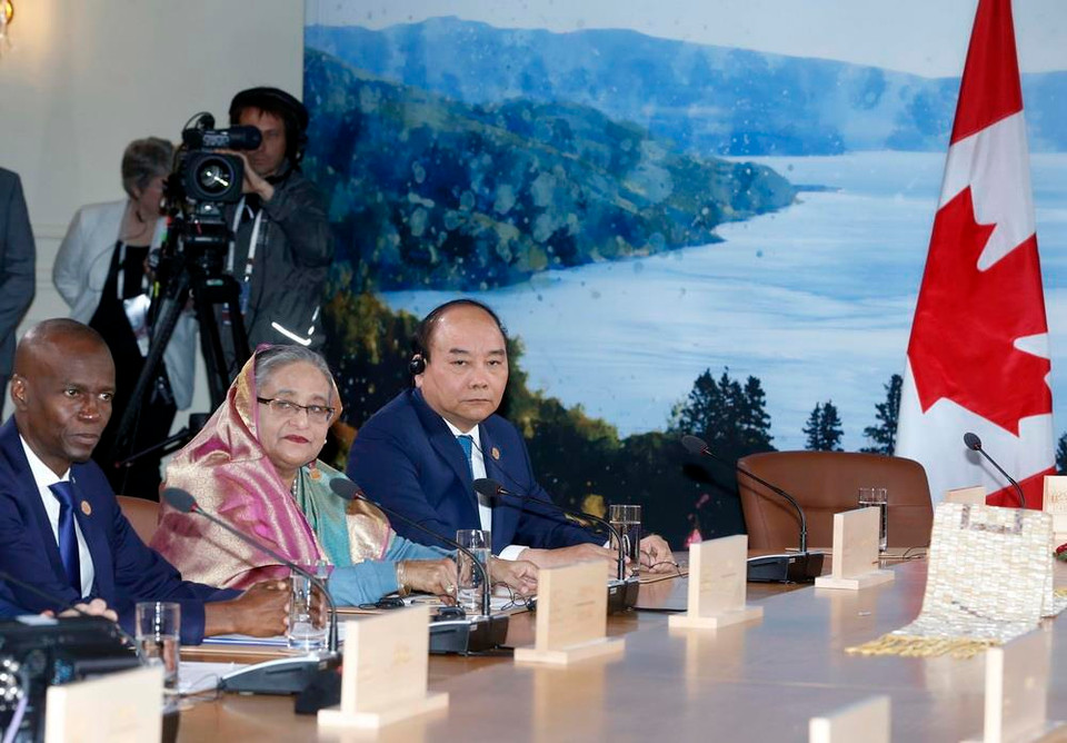 Thủ tướng Nguyễn Xuân Phúc dự Phiên làm việc với các trưởng đoàn G7 và G7 mở rộng, tại Hội nghị Thượng đỉnh Nhóm các nước công nghiệp phát triển hàng đầu thế giới (G7) mở rộng, sáng 9/6/2018, tại thành phố Charlevoix, Canada. (Ảnh: Thống Nhất/TTXVN)