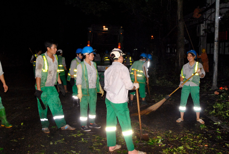 'Cười lên, xong chỗ này ta qua chỗ khác.' (Ảnh: Võ Phương/Vietnam+)