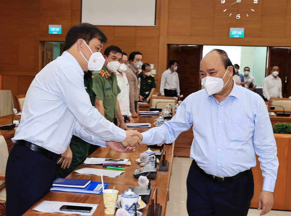 Sáng 30/7, tại Thành phố Hồ Chí Minh, Chủ tịch nước Nguyễn Xuân Phúc làm việc với lãnh đạo Thành phố Hồ Chí Minh về công tác phòng chống, dịch COVID- 19 trên địa bàn. (Ảnh: Thống Nhất/TTXVN)