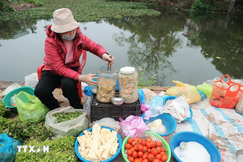 Chợ Đình Cả mỗi năm chỉ họp một phiên vào mùng 2 Tết. (Ảnh: Minh Quyết/TTXVN)