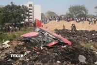 Hiện trường vụ rơi máy bay của Hãng Air India ở thành phố Ahmedabad, bang Gujarat, Ấn Độ ngày 13/6/2025. (Ảnh: THX/TTXVN)