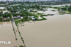 Mưa lớn gây ngập lụt ở phường Nam Nha Trang (Khánh Hòa). (Ảnh: TTXVN phát)