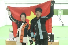 Mộng Tuyền và Tâm Quang thi đấu xuất sắc, mang về tấm HCV đầu tiên cho bắn súng Việt Nam. (Ảnh: TTXVN phát)